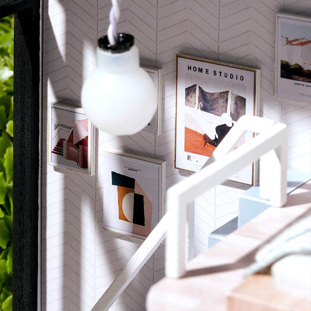 Built in LED pendant lamp lighting the miniature loft interior at night, a dollhouse apartment kit in Green, Blue and Pink accents