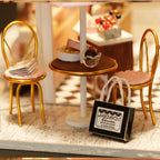 Miniature chocolate shop room box with a tiny bistro table and chairs, a 1:24 scale craft kit for adult hobbyists