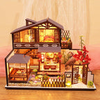 DIY dollhouse kit that builds a landscaped Japanese garden with a red maple tree and lily pond for miniature hobbyists