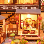 Warm lit Japanese miniature house scene with lanterns and a maple garden, a birthday or holiday gift for craft lovers