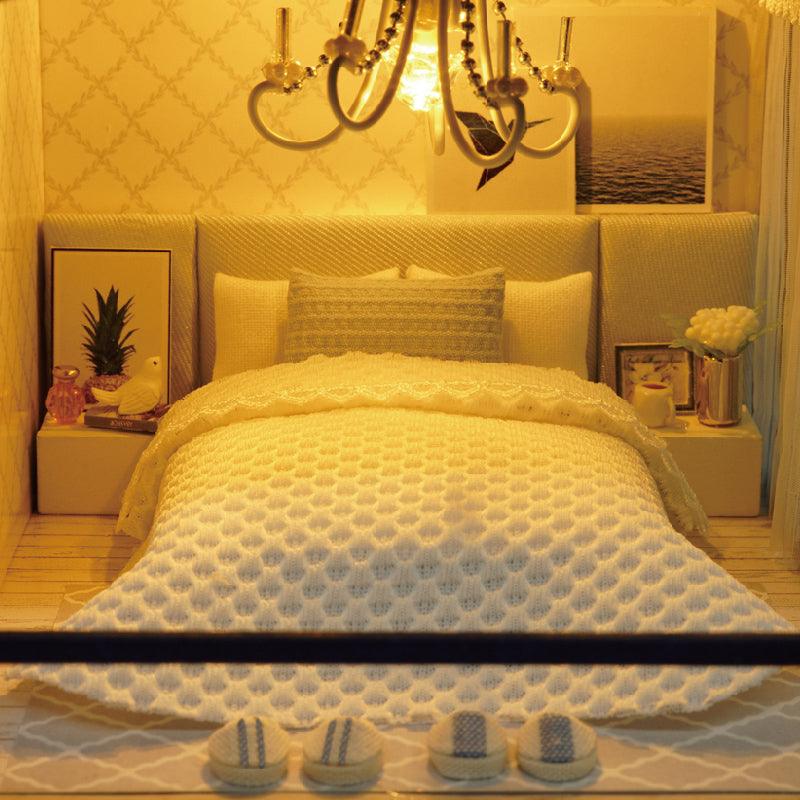 Miniature building kit with furniture and fittings for a warm lit dollhouse scene to assemble and then display Time Apartment Set + Music Box