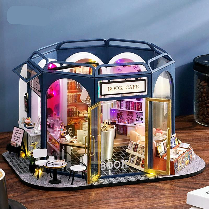 Book cafe miniature dollhouse kit in 1:24 scale, a LED lit DIY wooden model house and desk display for adult crafters