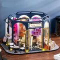 Book cafe miniature dollhouse kit in 1:24 scale, a LED lit DIY wooden model house and desk display for adult crafters