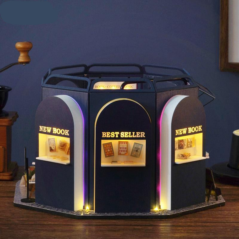 Miniature bookshop storefront with lit display windows, a 1:24 scale book and coffee shop diorama for miniature collectors