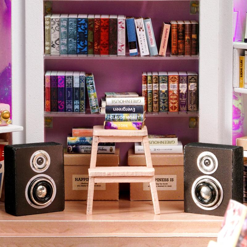 Miniature bookstore shelves filled with tiny books, a detailed 1:24 scale wooden dollhouse kit and gift for book lovers
