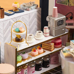 Miniature cafe counter with tiny cakes, macarons and coffee, a 1:24 scale bookshop diorama kit for dollhouse builders