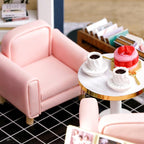 Cozy cafe corner with a pink armchair and coffee table, a handmade miniature room box and craft gift for collectors