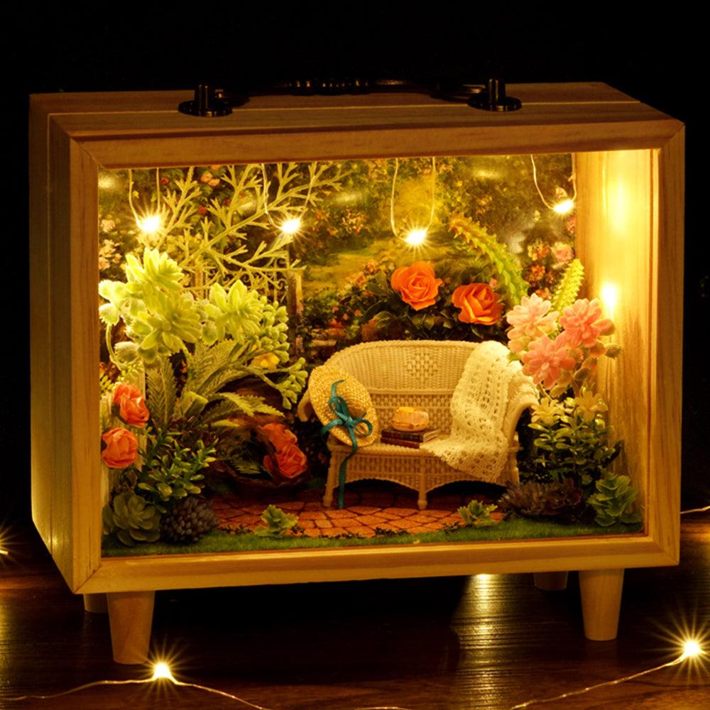 DIY dollhouse room box with a built-in music box and soft lighting for a relaxing screen-free building hobby at home Aromatic Bakery and Sunflower Garden designs.