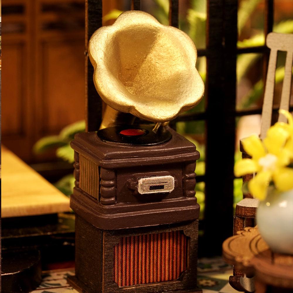 Detailed miniature furniture and room accessories in a hand-assembled dollhouse kit with LED glow for hobby crafters