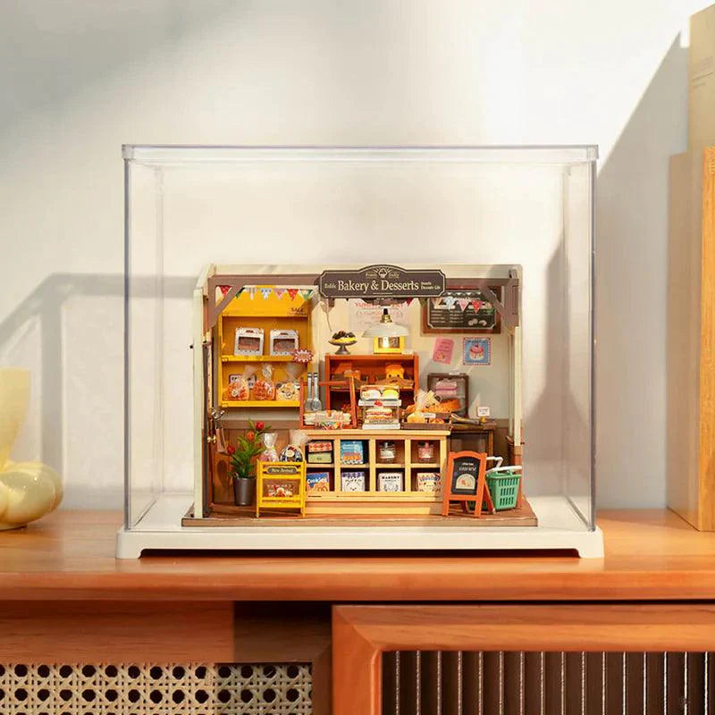 Stackable acrylic showcase for miniature collections with a multi layer design to display several dollhouses together