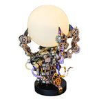 3D metal dragon claw lamp puzzle in stainless steel gripping a glowing orb, a 1000 piece model kit for adult builders
