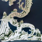 Tarnish resistant steel dragon model that keeps fine detail on a desk or shelf for a long term collectible look Silver