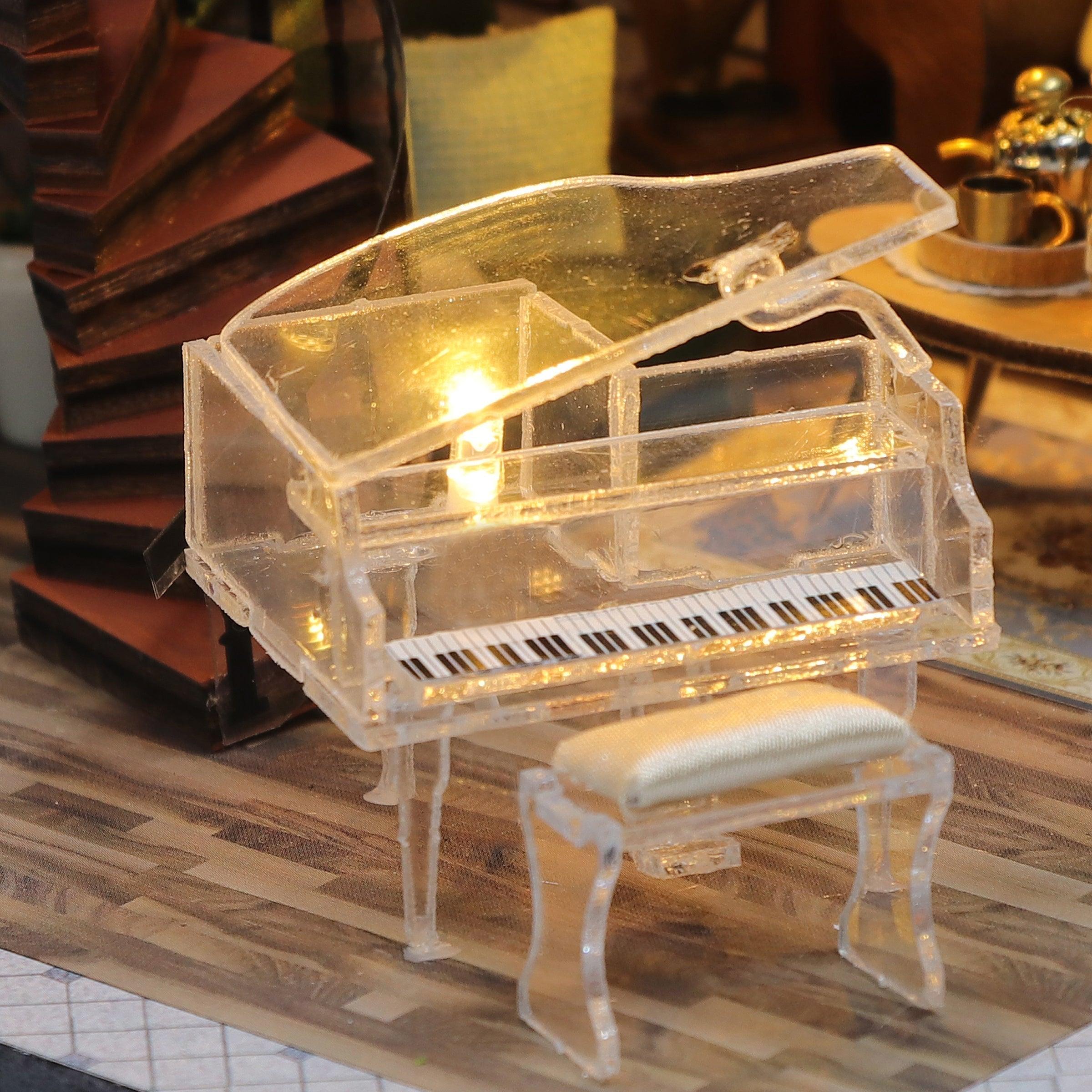 Illuminated miniature mansion with LED lighting, decorative railings and arched windows for a shelf or desk display