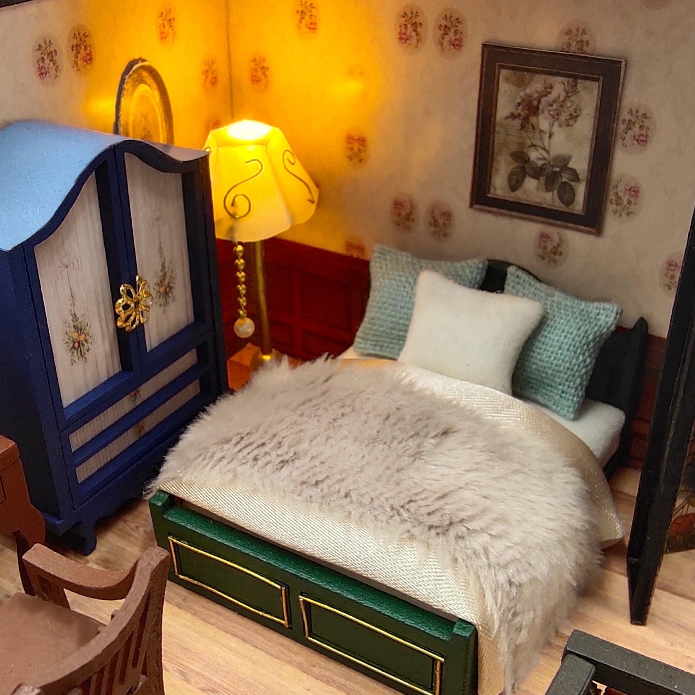 Dream Building Pavilion dollhouse with a clear dust cover protecting the finished three floor 1:24 wooden build