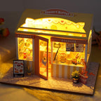 Miniature dessert shop dollhouse kit with a cake buffet display and warm LED light for adult hobby model builders Delicious cake