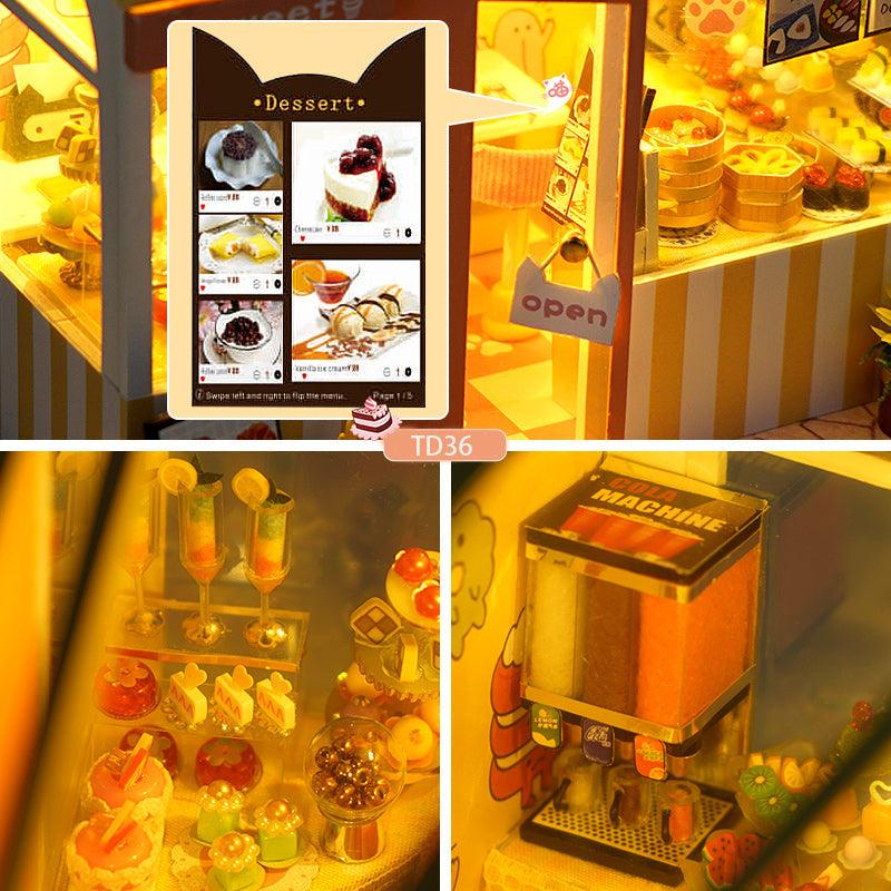 Miniature cakes, parfaits, and a drink machine detail this dessert shop craft kit for adult hobbyists and gifting Delicious cake