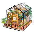 Enchanted greenhouse garden miniature kit with warm LED lights and glass walls, a 389 piece botanical dollhouse for adults