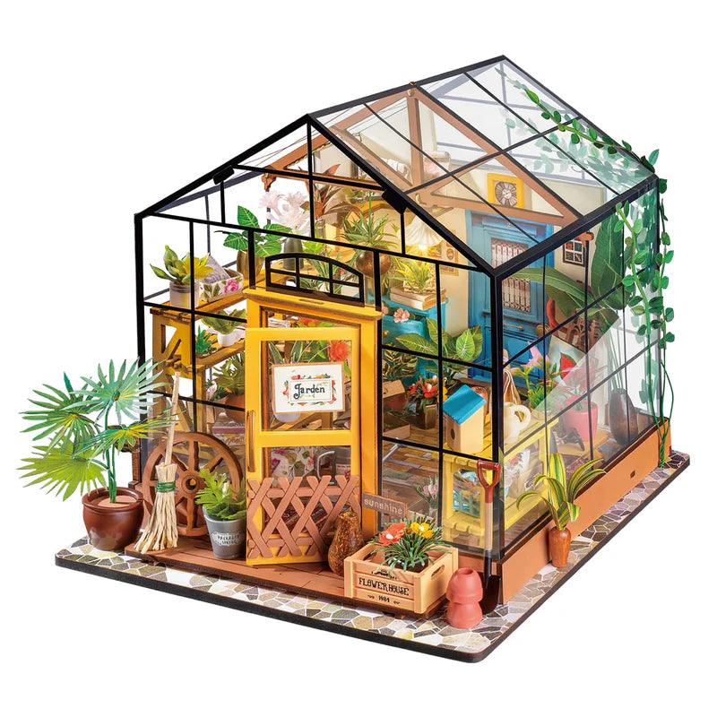 Enchanted greenhouse garden miniature kit with warm LED lights and glass walls, a 389 piece botanical dollhouse for adults