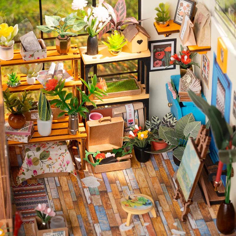 Glass greenhouse miniature with flower pots, gardening tools, and rustic wooden furniture, a botanical garden model for adults