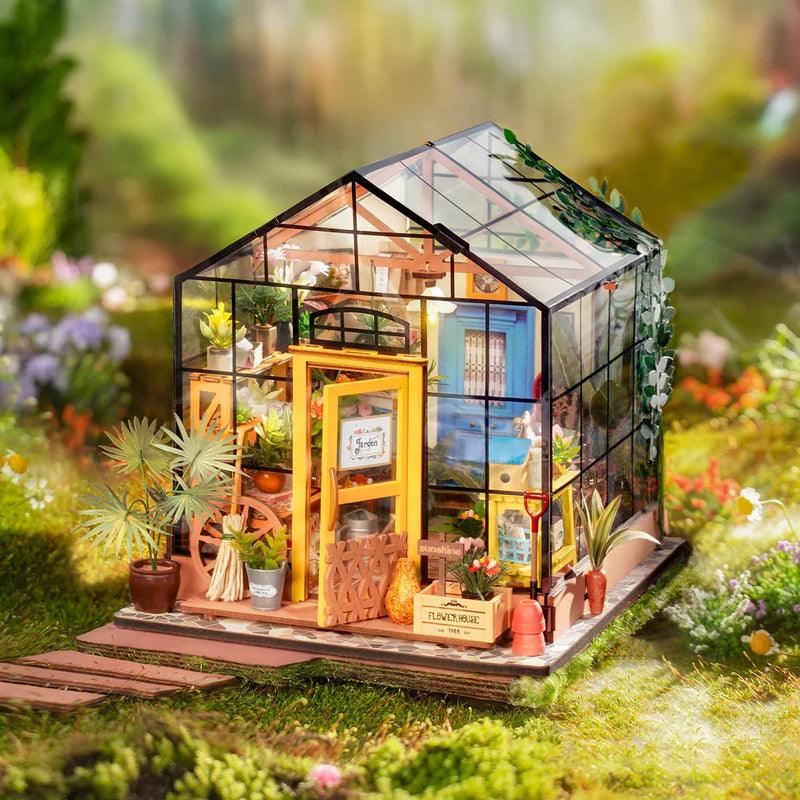 Greenhouse garden dollhouse with a painting corner easel and palette, a lit miniature build kit for craft and plant lovers