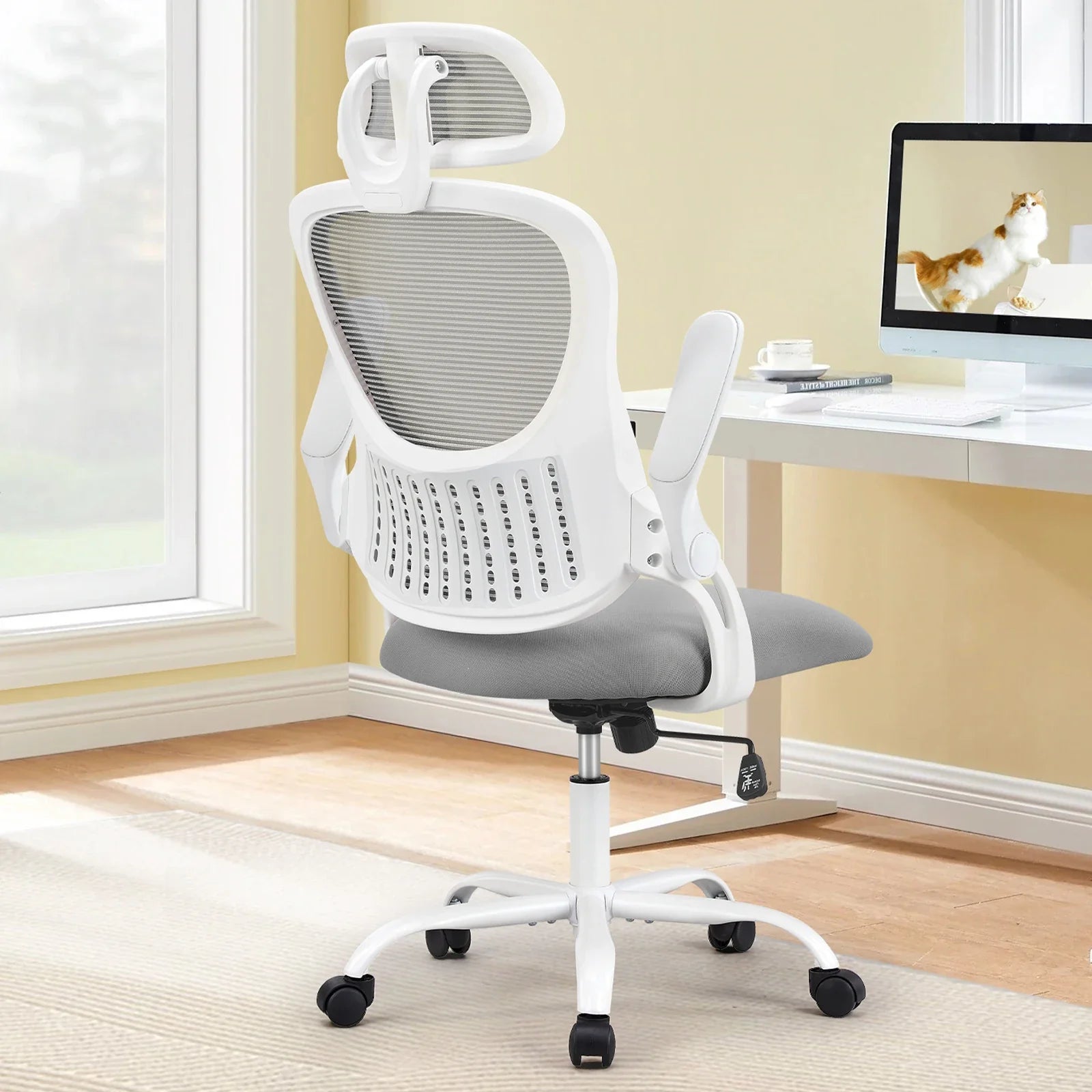 Ergonomic mesh office chair with adjustable headrest and flip-up arms for a home office desk, breathable high back, Gray