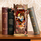 Laser cut wooden book nook model kit with numbered parts you assemble by hand into a lit Alice in Wonderland scene