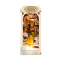Japanese cherry blossom book nook kit with a warm LED river and pagodas, a lit bookshelf diorama for booklovers