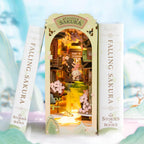 Illuminated sakura book nook that slots between books on a shelf, a Japanese diorama gift for readers and crafters