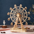 Assembled ferris wheel wooden music box turning on a round base, a wind up mechanical model for desk and shelf decor