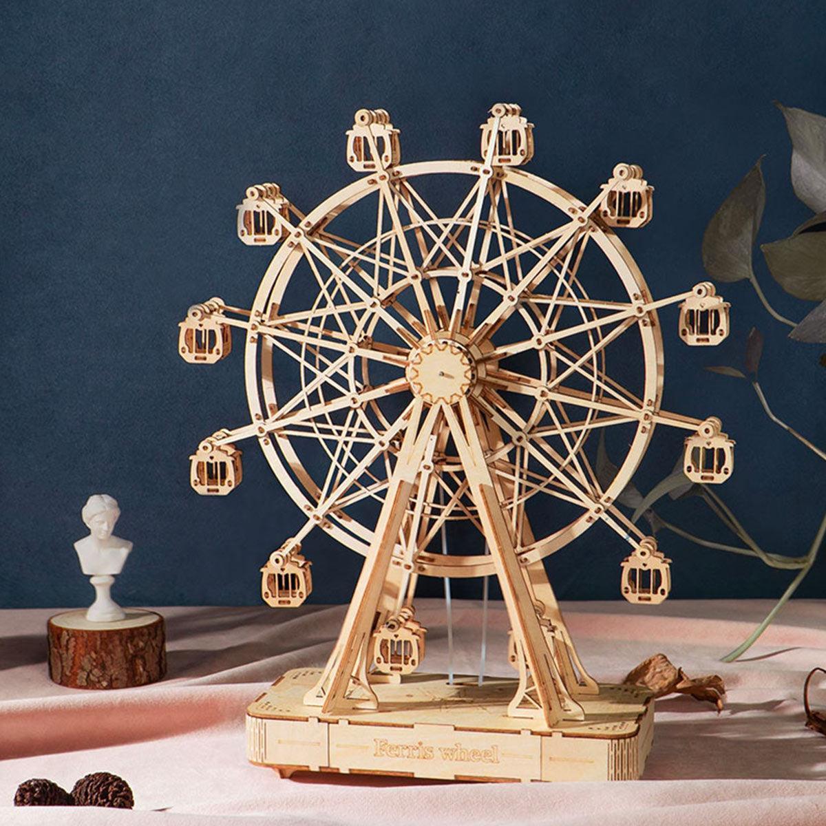 Assembled ferris wheel wooden music box turning on a round base, a wind up mechanical model for desk and shelf decor