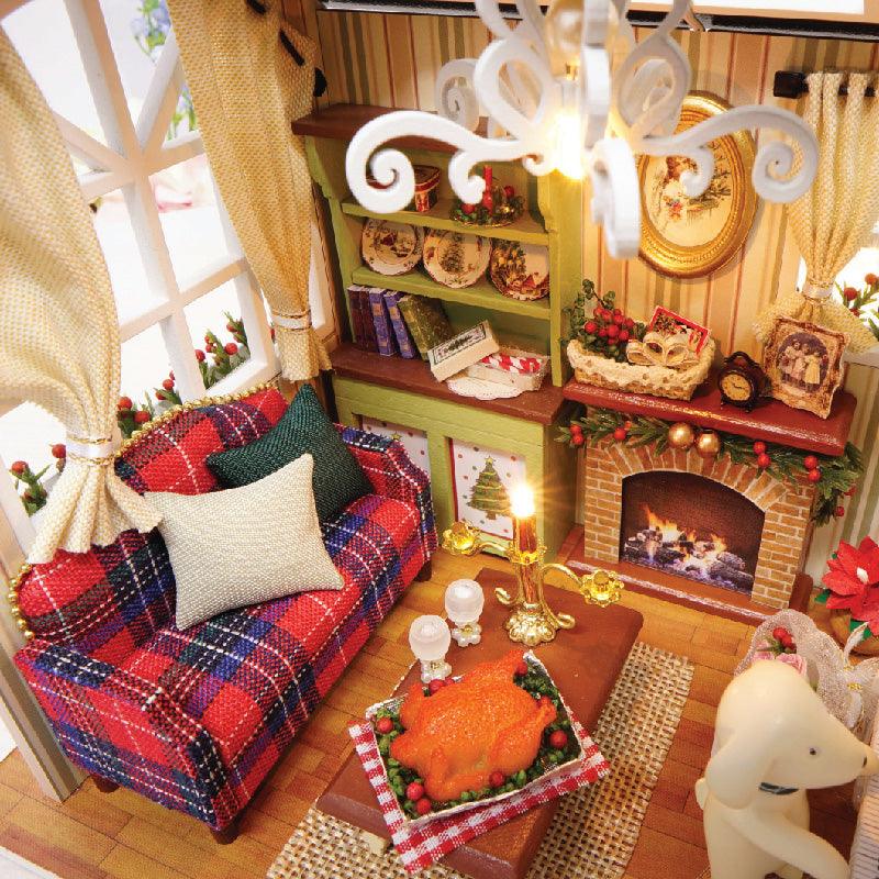 Warm LED lighting brings a soft glow to this winter holiday scene and cozy seasonal tabletop decoration