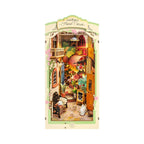 Floral corner book nook kit that builds a lit miniature flower shop between your books, a warm LED diorama for readers