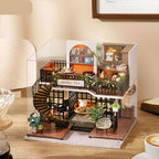 Forest teashop dollhouse kit in 1:24 scale, a woodland cafe miniature with warm LED light for adult crafters