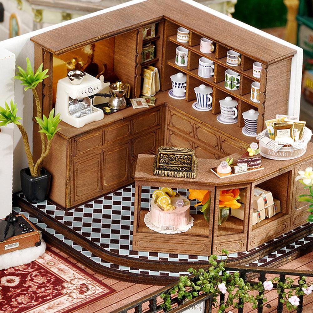 Handmade forest teashop diorama with detailed furniture and nature accents, a craft gift for miniature fans