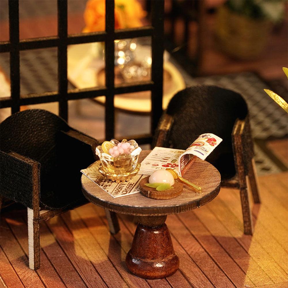 Forest-themed roombox kit with tiny tea shop furnishings, a relaxing craft project and collectible gift idea