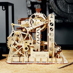 Kinetic marble machine driven by cogs, cranks, and wheels, a buildable wooden toy that teaches motion and mechanics