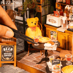 Parisian sidewalk cafe scene with a bear figurine, vintage outdoor tables and food props for a detailed miniature build