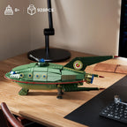 Green starship model displayed as sci-fi desk decor, a 928 piece building blocks set and gift idea for spaceship fans