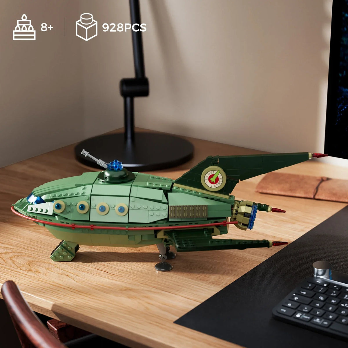 Green starship model displayed as sci-fi desk decor, a 928 piece building blocks set and gift idea for spaceship fans