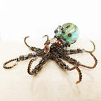 Metal steampunk octopus with a green cosmic orb and gear tentacles as a color changing centerpiece for adult fans Star light Galaxy Light