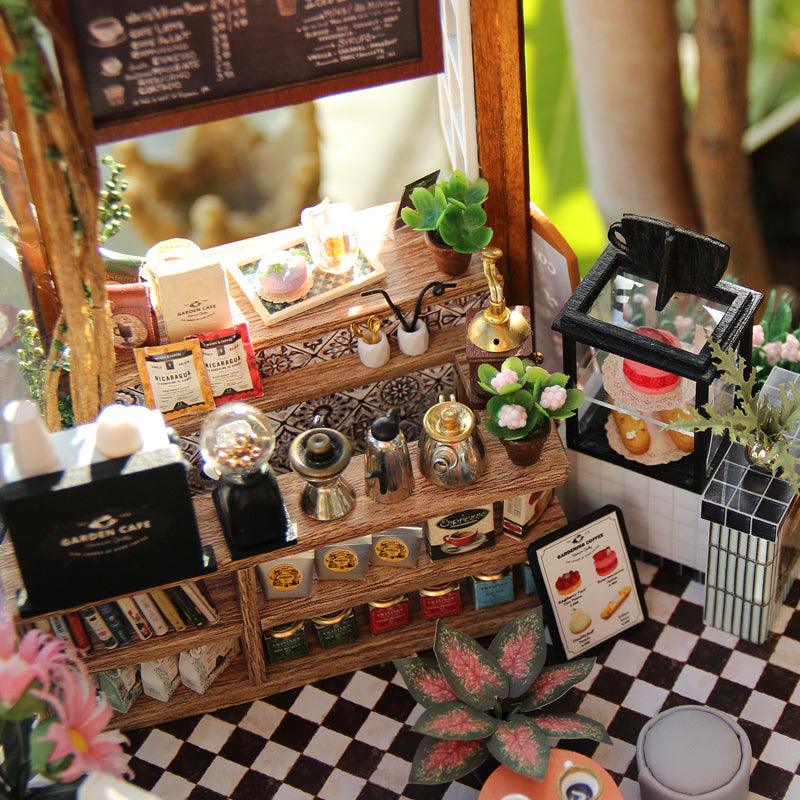 Miniature garden cafe with potted plants and flowers, a handmade 1:24 scale room box display for shelf or desk