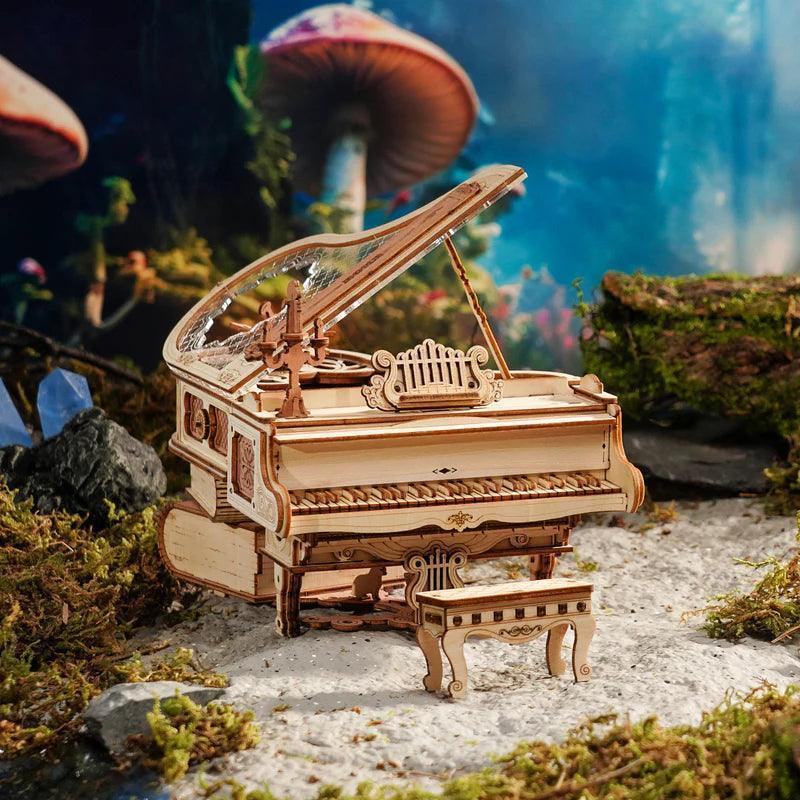 3D wooden puzzle grand piano with a clear acrylic lid that reveals the moving wooden gears and keys inside