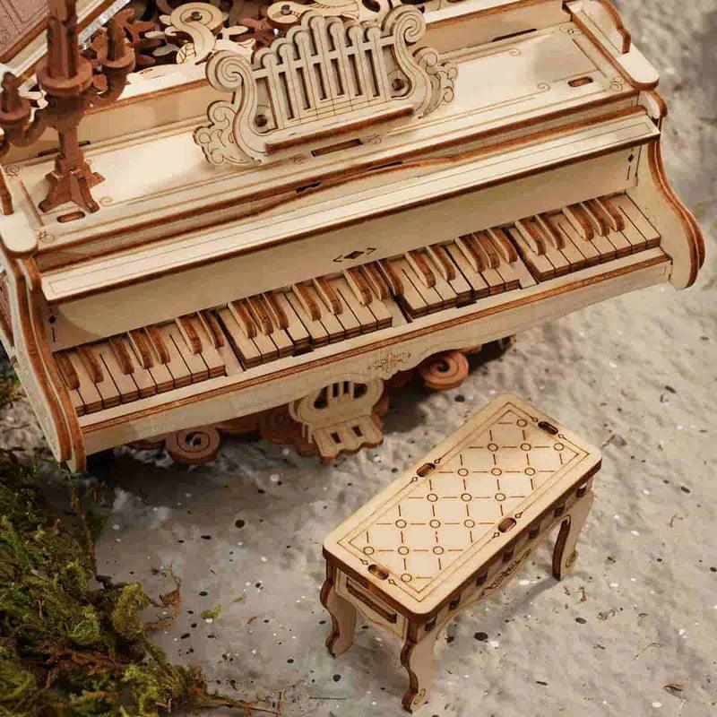Mechanical wooden music box puzzle powered by a hand crank and interlocking gears for adult puzzle enthusiasts