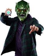 Adult in Green Goblin Marvel Legends helmet with Spider-Man No Way Home pumpkin bomb prop for villain cosplay scene