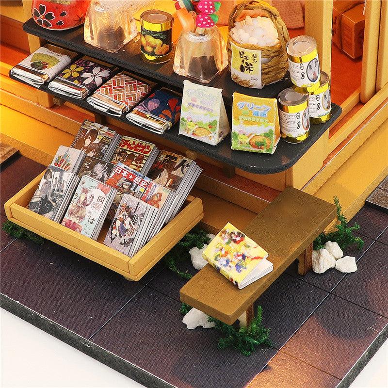 Miniature magazine and manga rack outside a tiny grocery store, a Japanese roombox craft kit for model makers and gifts