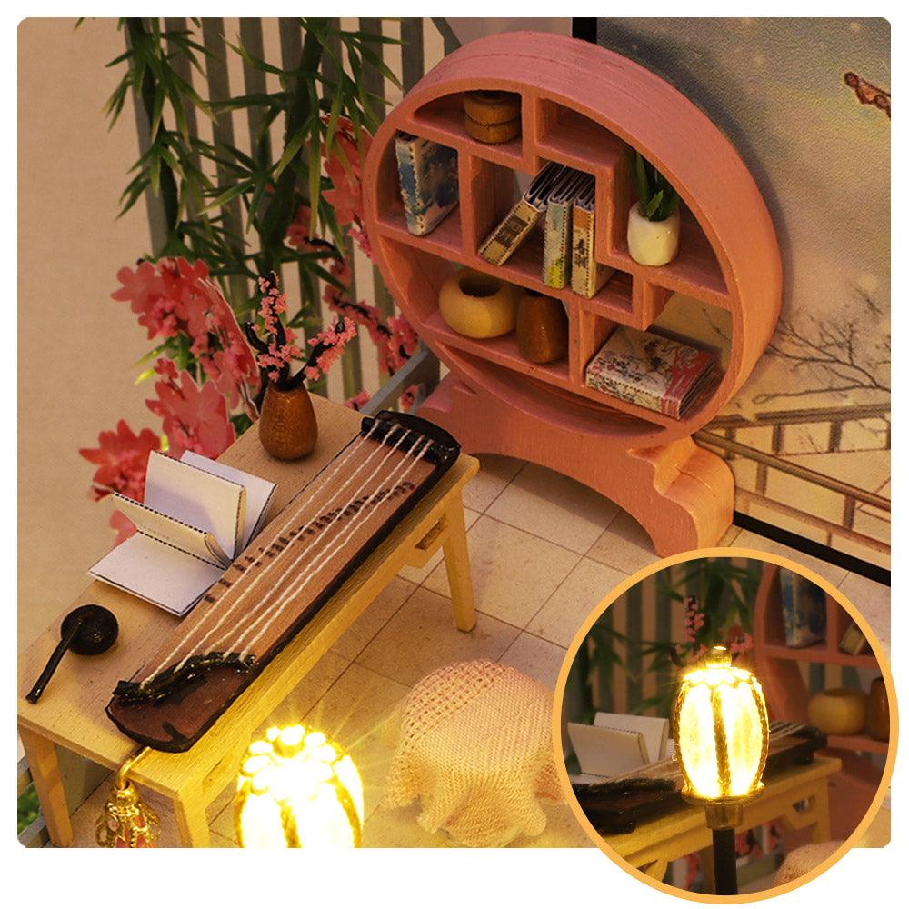 Guqin Pavilion study nook with Chinese zither and round bookshelf, an illuminated 1:24 miniature model kit with wind-up music box