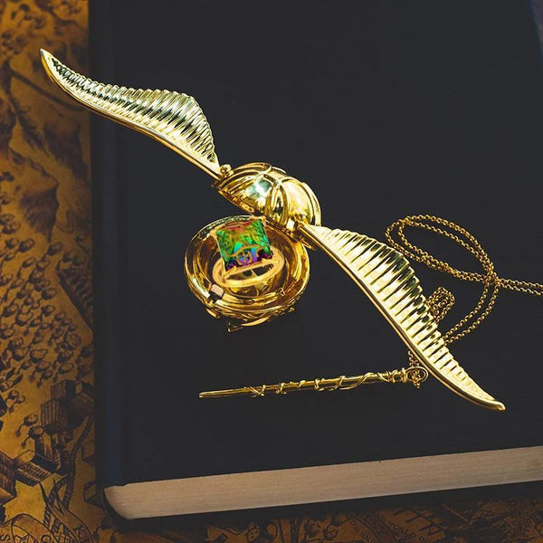 Golden Snitch ring box with gold plated wings that open to a velvet insert for a Harry Potter proposal keepsake RNGBX1