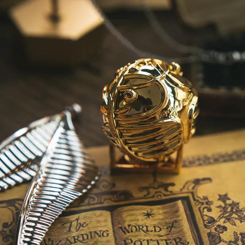 Silver winged Golden Snitch box on a wizarding map, a Harry Potter collector display and proposal ring keepsake RNGBX2