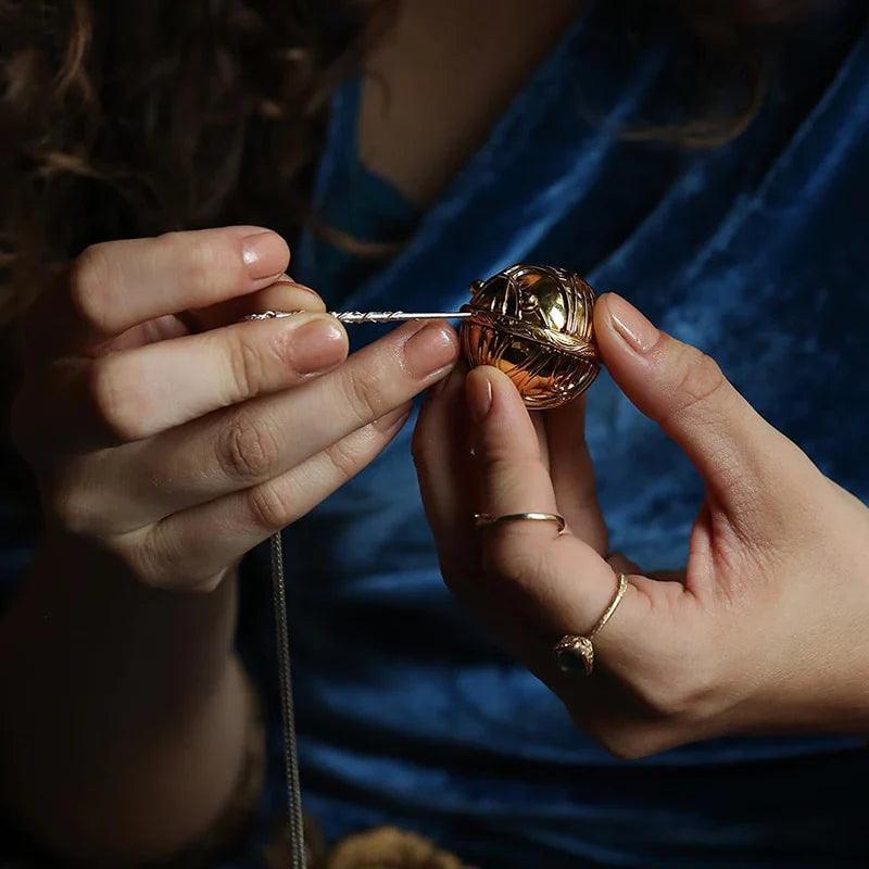 Winged Golden Snitch box unlocked by a wand shaped key, a collectible Harry Potter engagement ring holder for fans RNGBX1