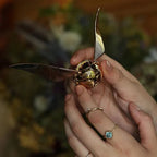 Gold plated snitch jewelry box opening to reveal the ring compartment, a wizarding world proposal gift for Potterheads RNGBX1
